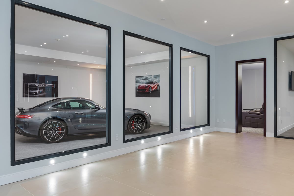modern home with view into garage with sports car