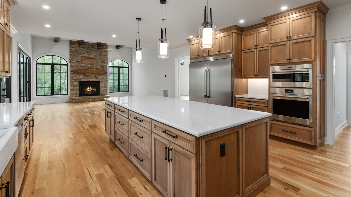 Kitchen with large island overlooking the living room area