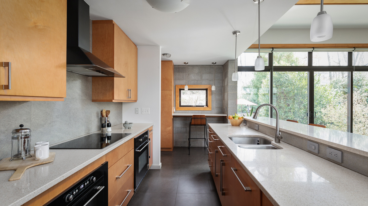 Galley style kitchen with island