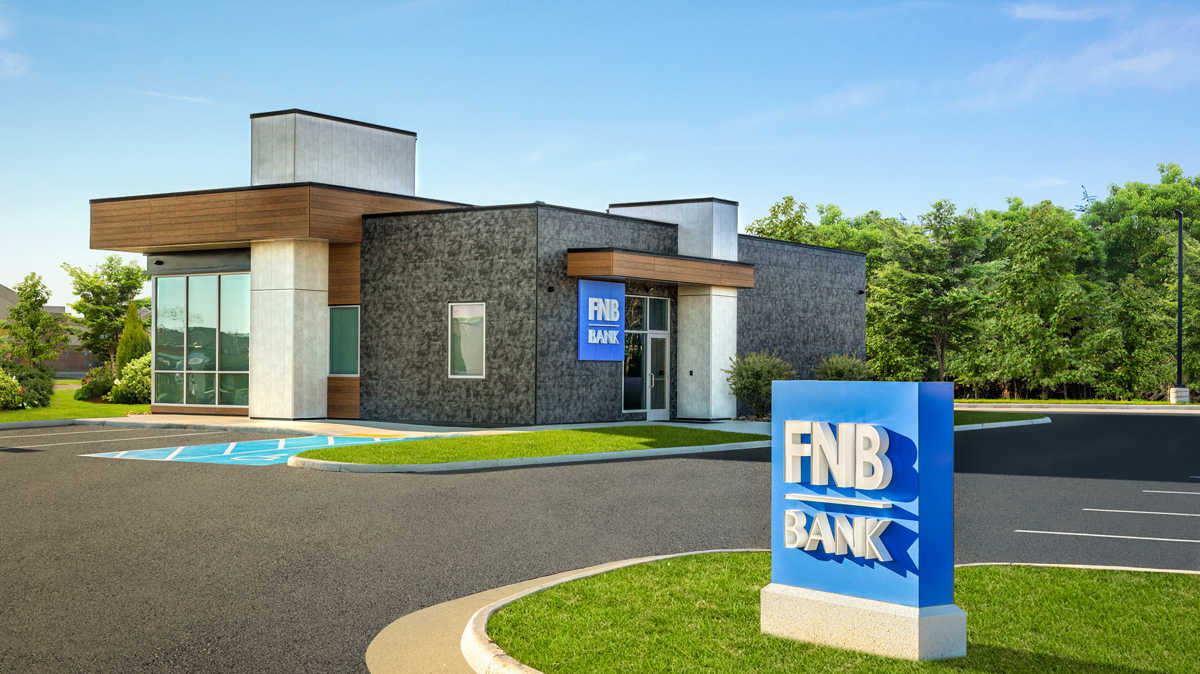 FNB Bank sign with building and parking lot