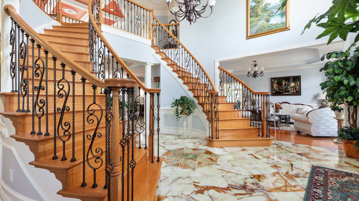 elegant entry way with a double staircase