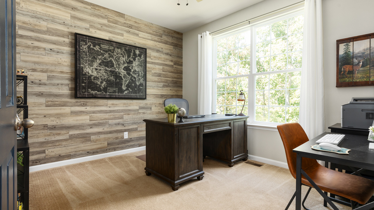 home office with rustic wood wall