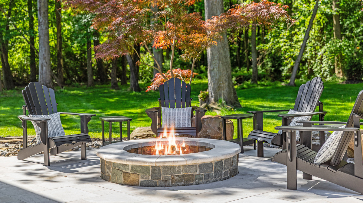 backyard fire pit with Adirondack chairs