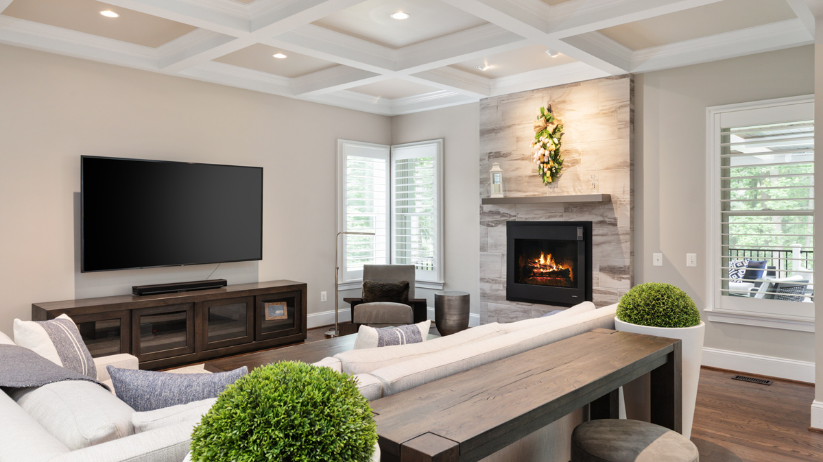 Den area with mounted tv and electric fireplace