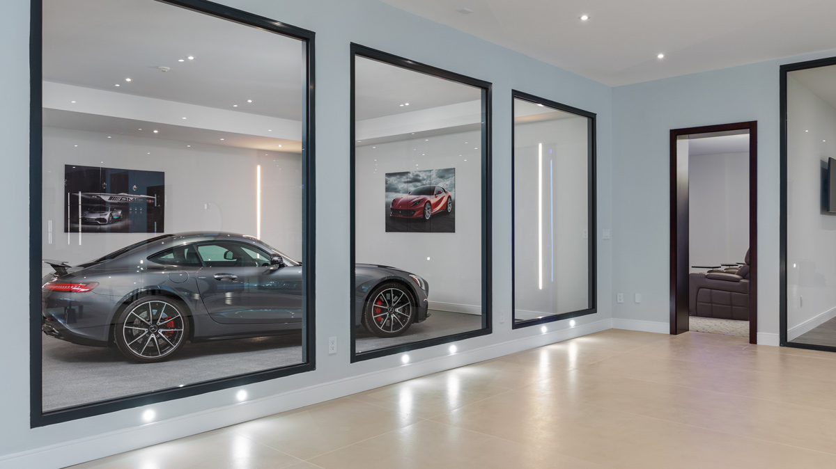 hallway with windows viewing sports car parked in garage