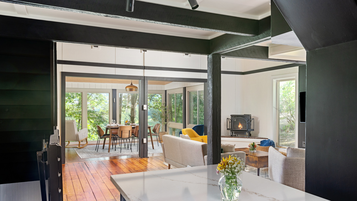 small living room opening up to the porch dining area