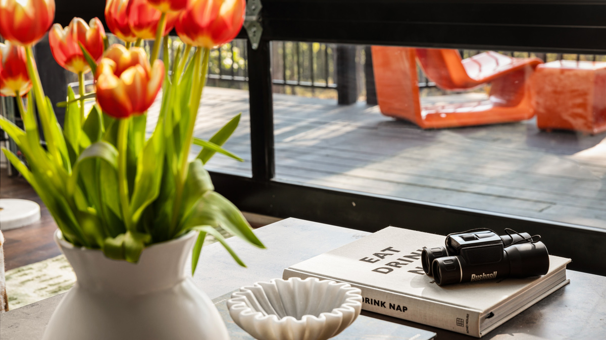 coffee table with tulips and reading materials