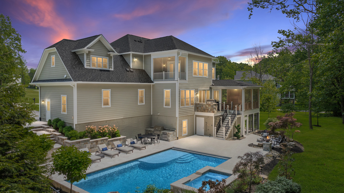 backyard patio with in-ground pool, hot tub, and seating areas